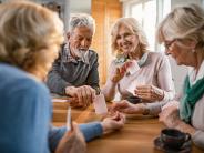 Older adults playing cards