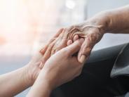 young hands holding old hands