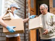 A meal being delivered to an older adult person