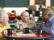 3 multi-cultural men having coffee