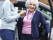 2 women by a car