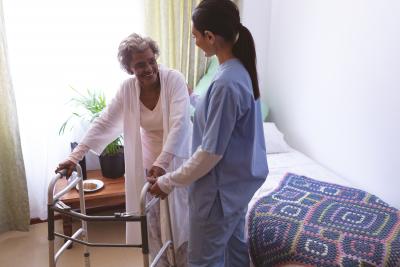 Woman helping another woman 