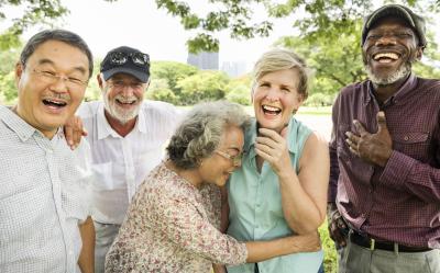 Mature Adults in a group smiling and laughing